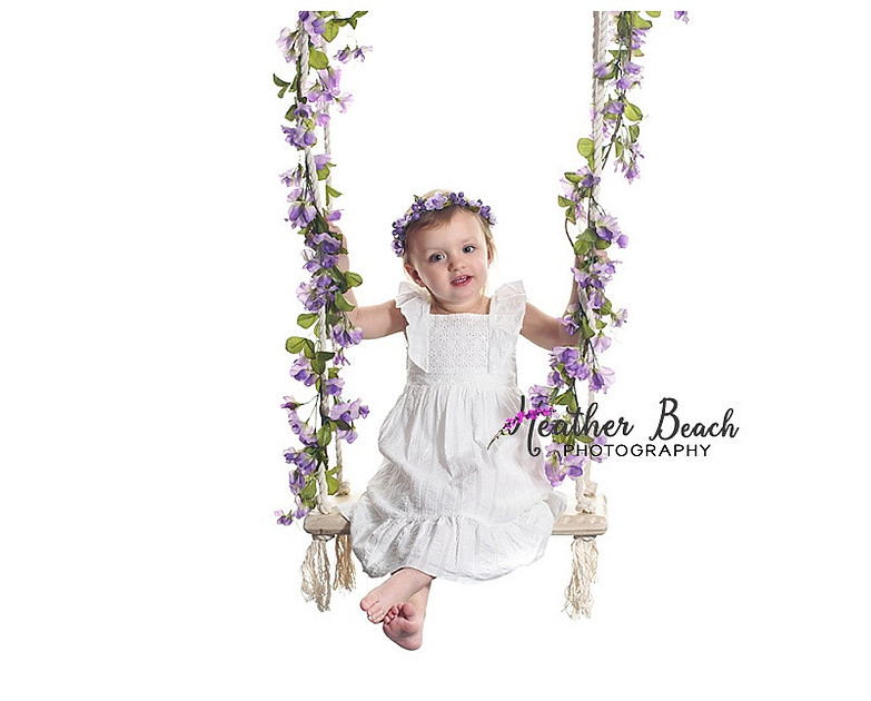 Child photos, studio pictures with swing, wood, flowers and teepee