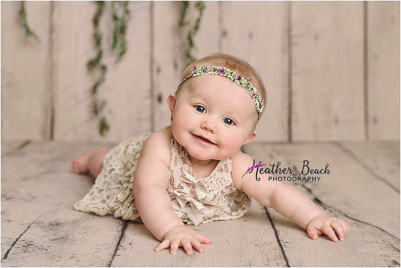 Sun Prairie baby photographer, Sun Prairie portrait photographer, Sun Prairie child photographer, Madison baby photographer, Madison portrait photographer, 6 month old, baby girl, halo headband, flowers, wood, cute baby, cute baby pics, studio photography, child photography, baby photography, Sun Prairie studio