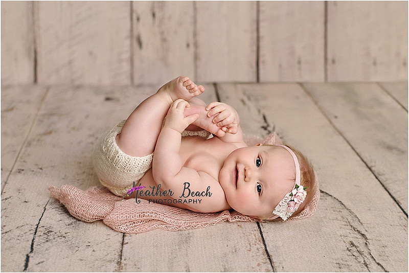 Sun Prairie baby photographer, Sun Prairie portrait photographer, Sun Prairie child photographer, Madison baby photographer, Madison portrait photographer, 6 month old, baby girl, halo headband, flowers, wood, cute baby, cute baby pics, studio photography, child photography, baby photography, Sun Prairie studio