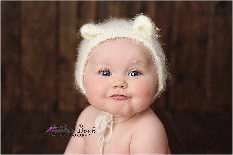 Sun Prairie baby photographer, Sun Prairie portrait photographer, Sun Prairie child photographer, Madison baby photographer, Madison portrait photographer, 6 month old, baby girl, halo headband, flowers, wood, cute baby, cute baby pics, studio photography, child photography, baby photography, Sun Prairie studio