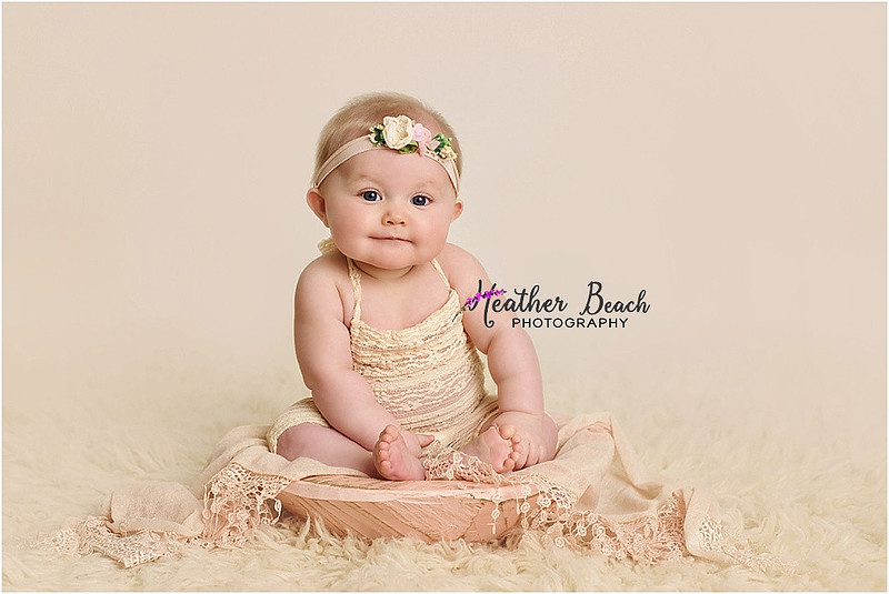 Sun Prairie baby photographer, Sun Prairie portrait photographer, Sun Prairie child photographer, Madison baby photographer, Madison portrait photographer, 6 month old, baby girl, halo headband, flowers, wood, cute baby, cute baby pics, studio photography, child photography, baby photography, Sun Prairie studio